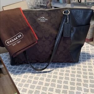 Coach Women's City Tote Bag in Signature Black Canvas and side Leather Pockets….